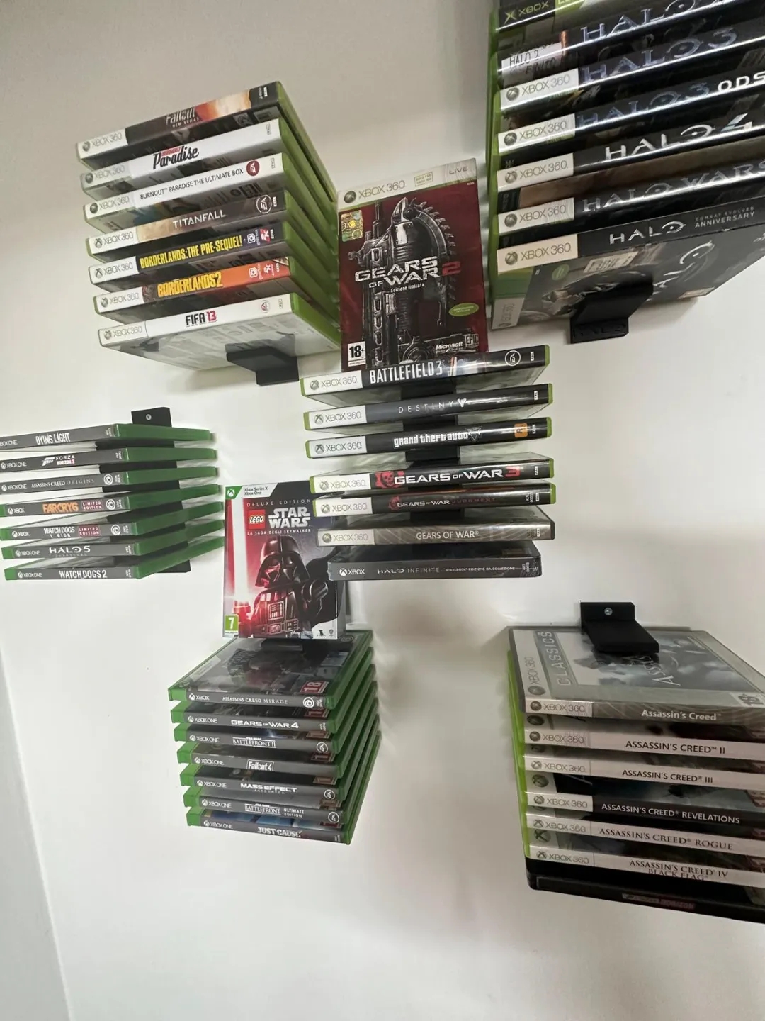 Organize Your Game Collection with Our Wall-Mounted Game Box Holder Keep your Xbox or PlayStation game boxes neatly stored and easily accessible with our 3D-printed wall-mounted game box holder. This sleek and modern design will not only help you declutter your gaming space but also add a touch of style. Features: Wall-Mounted Design: Saves space and keeps your game boxes within reach. Customizable: Can be designed to fit various game box sizes and quantities. Durable Construction: Made from high-quality materials for long-lasting use. Sleek and Modern Design: Adds a touch of style to your gaming setup. Upgrade your gaming experience with our 3D-printed wall-mounted game box holder.