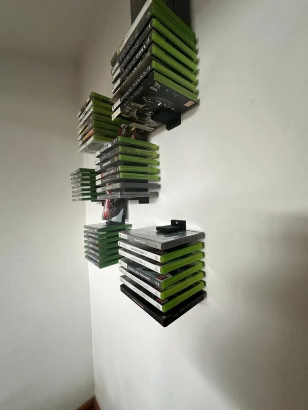 Organize Your Game Collection with Our Wall-Mounted Game Box Holder Keep your Xbox or PlayStation game boxes neatly stored and easily accessible with our 3D-printed wall-mounted game box holder. This sleek and modern design will not only help you declutter your gaming space but also add a touch of style. Features: Wall-Mounted Design: Saves space and keeps your game boxes within reach. Customizable: Can be designed to fit various game box sizes and quantities. Durable Construction: Made from high-quality materials for long-lasting use. Sleek and Modern Design: Adds a touch of style to your gaming setup. Upgrade your gaming experience with our 3D-printed wall-mounted game box holder.