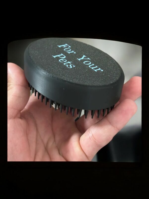 Palm-Sized Pet Grooming Made Easy Introducing our innovative 3D-printed palm-held pet brush! This compact and portable tool is perfect for on-the-go grooming sessions or quick touch-ups between baths. Its ergonomic design fits comfortably in your hand, making it easy to reach those hard-to-reach places. Features: Portable and Compact: Easily fits in your pocket or purse for convenient grooming on the go. Ergonomic Design: Comfortable grip for easy use. Gentle on Your Pet's Coat: Soft bristles that remove loose hair without irritating your pet's skin. Durable Construction: Made from high-quality materials for long-lasting use. Give your furry friend a quick and easy grooming session with our palm-held pet brush.